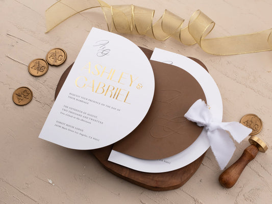Sophisticated Gold Foil Invite Wrapped in Brown Jacket with Ribbon - LA Invitations Co