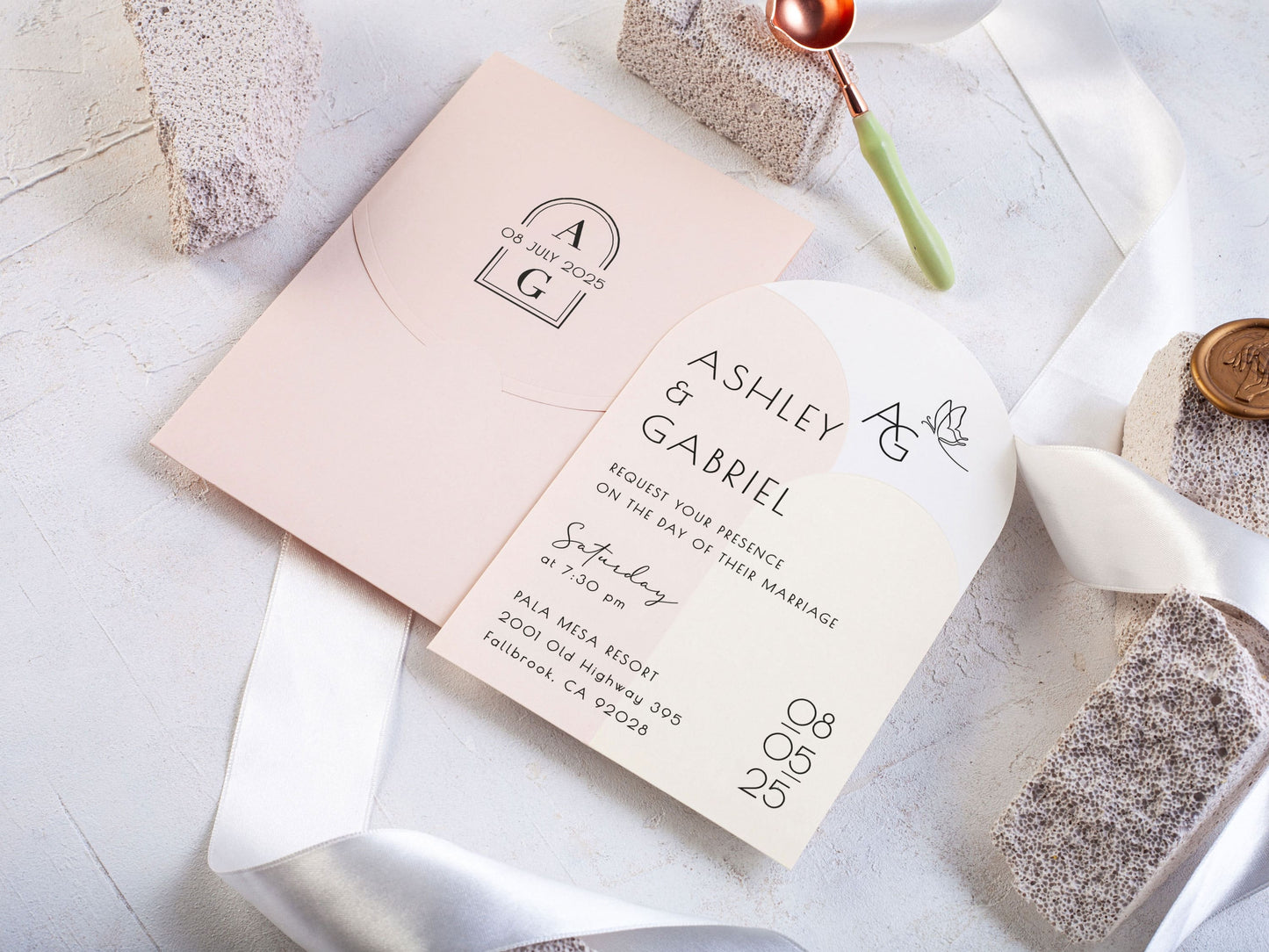 Minimal Arch Wedding Invite Paired with a Soft Pink Envelope